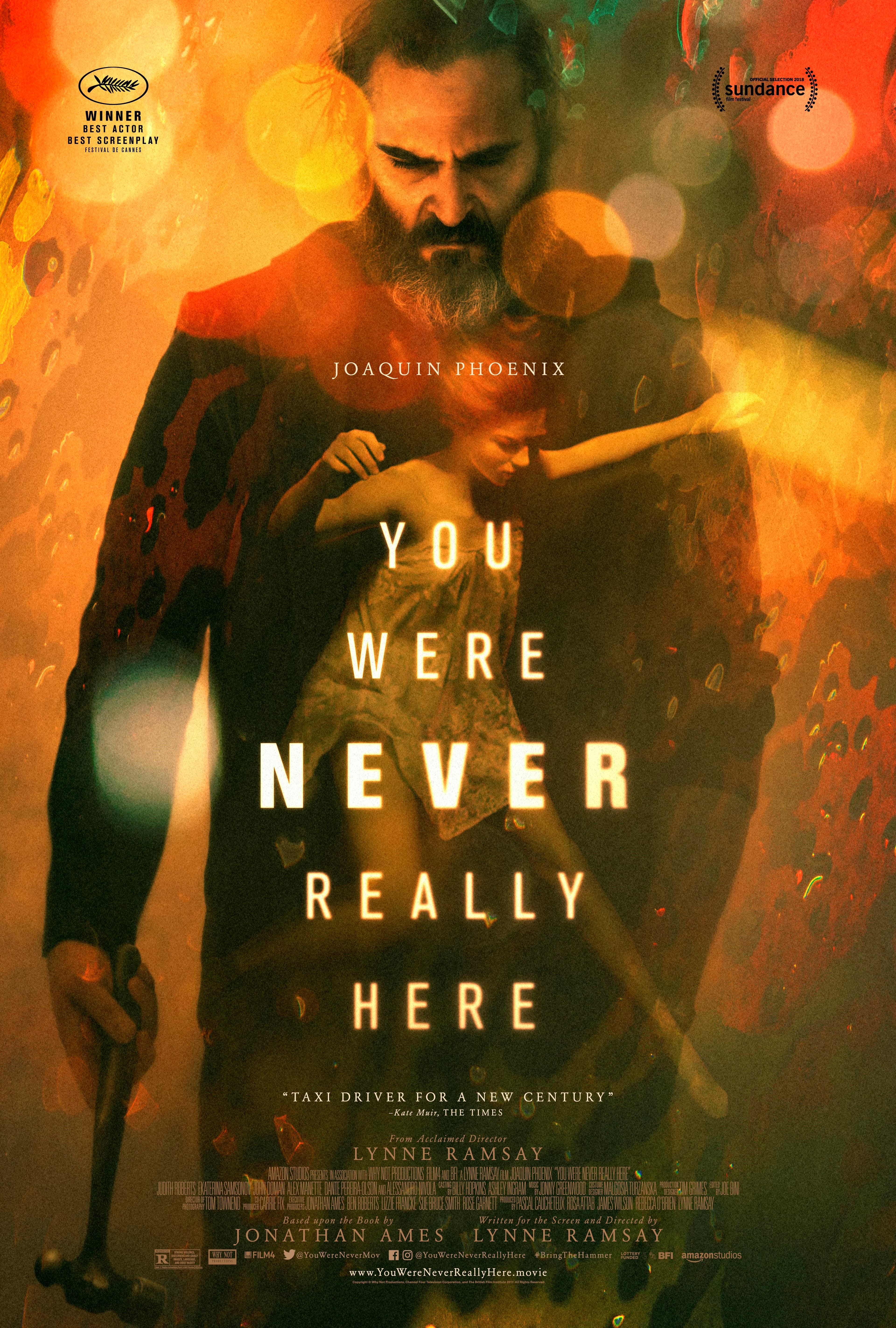 Bearded Joaquin Phoenix holds a hammer on the 'You Were Never Really Here' movie poster.